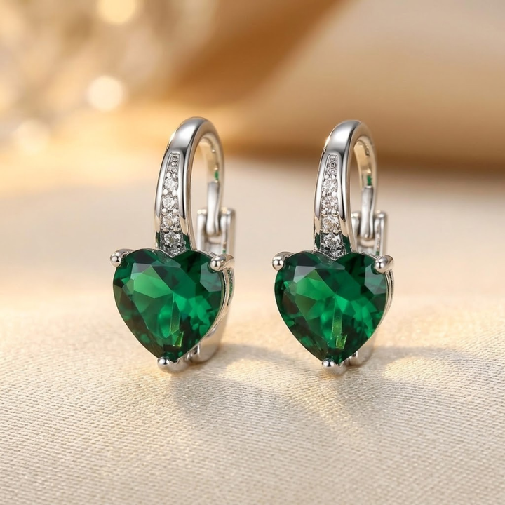 Heart-Shaped Silver Hoop Earrings with Emerald Accents
