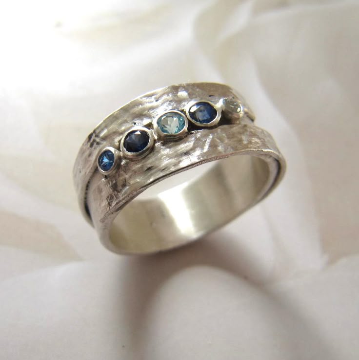 Silver Band Featuring Blue Inlaid Gemstones