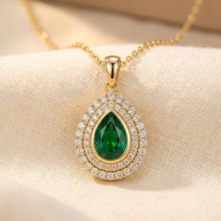 Gold Teardrop Necklace with Emerald Accent