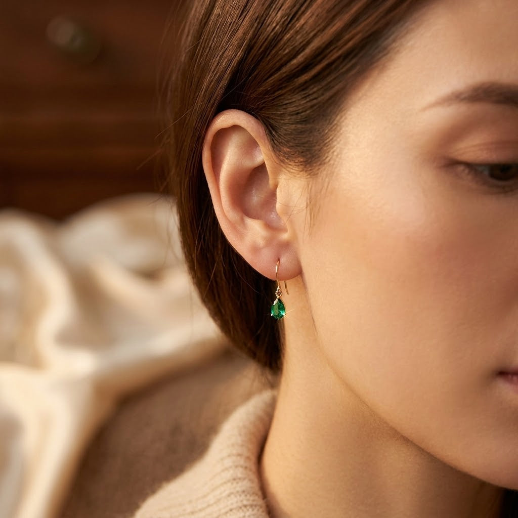 Gold Drop Earrings with Emerald Teardrop Design