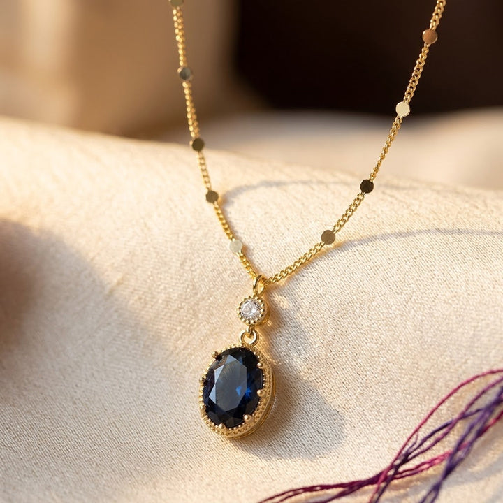 Gold Oval Drop Necklace with Sapphire Accent