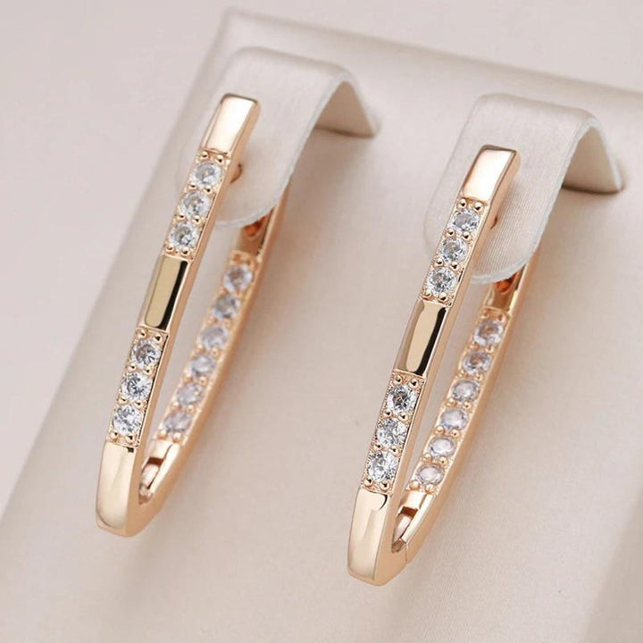 Elegant Gold Earrings Adorned with Zirconia Details