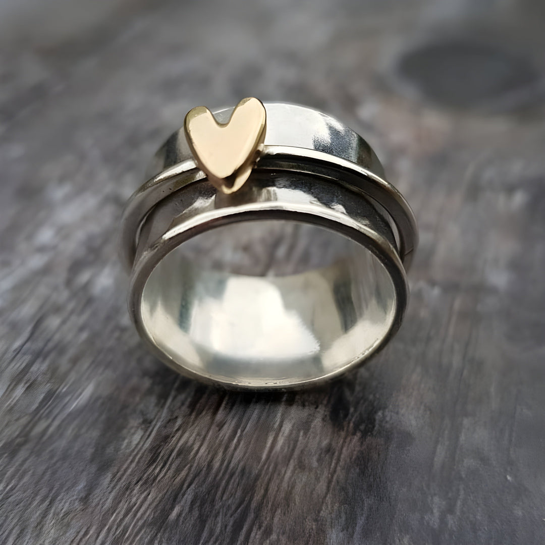 Vintage Silver Ring Featuring a Golden Heart Detail
