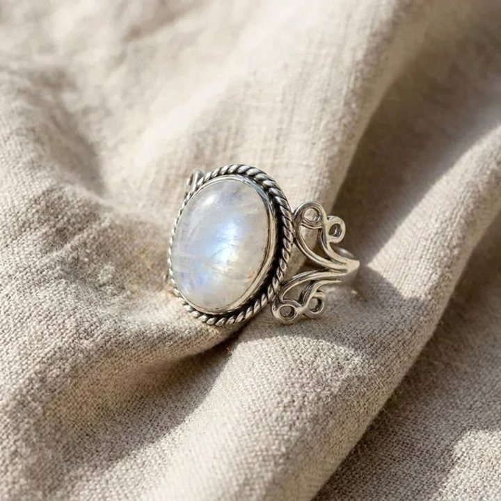 Oval Moonstone Ring with Scroll Band Design