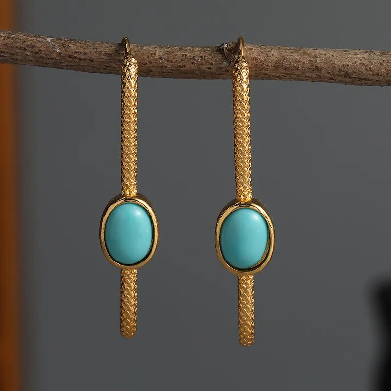 Stylish Turquoise Gemstone Earrings Featuring Sophisticated Gold Details