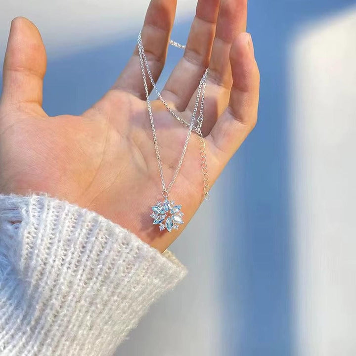 White Gold Floral Pendant Necklace Featuring Blue Snowflake Detail