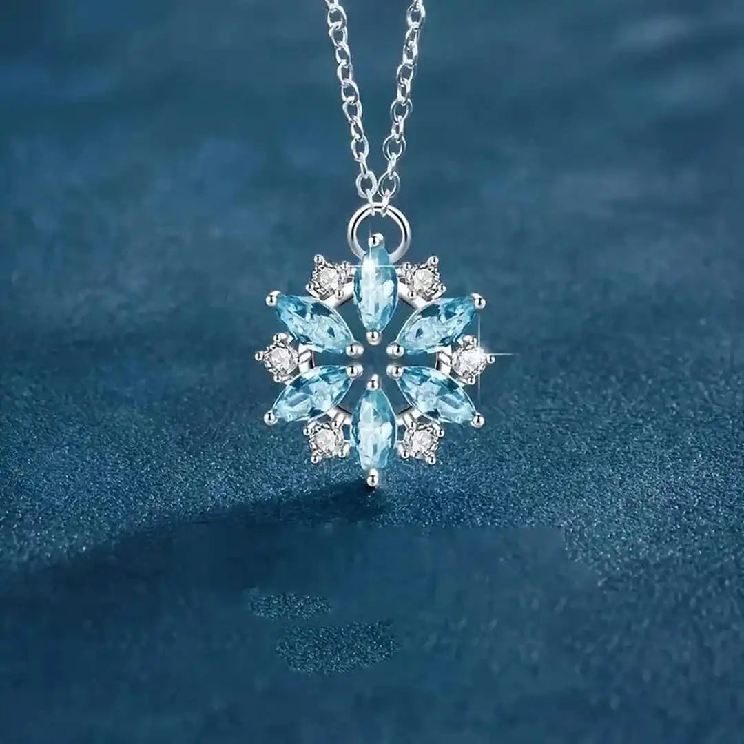 White Gold Floral Pendant Necklace Featuring Blue Snowflake Detail
