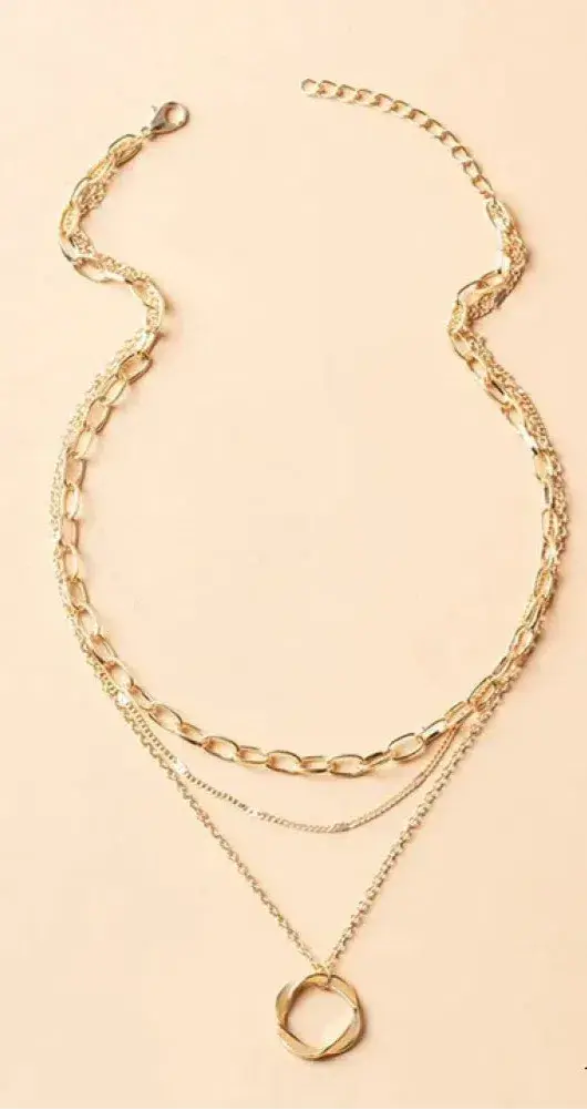 Vintage-inspired gold layered chain necklace with charm